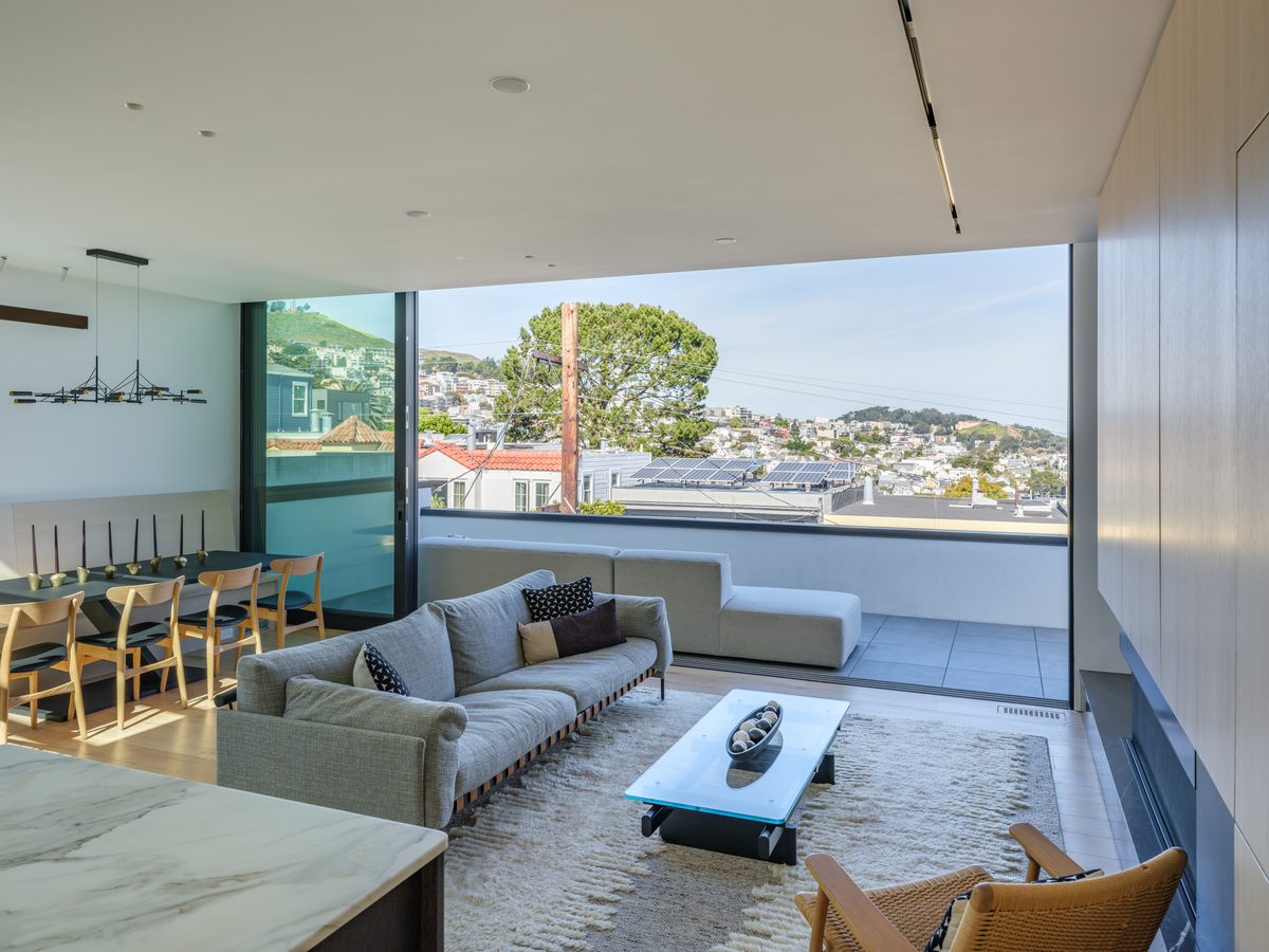 Living room with city view and terrace beyond