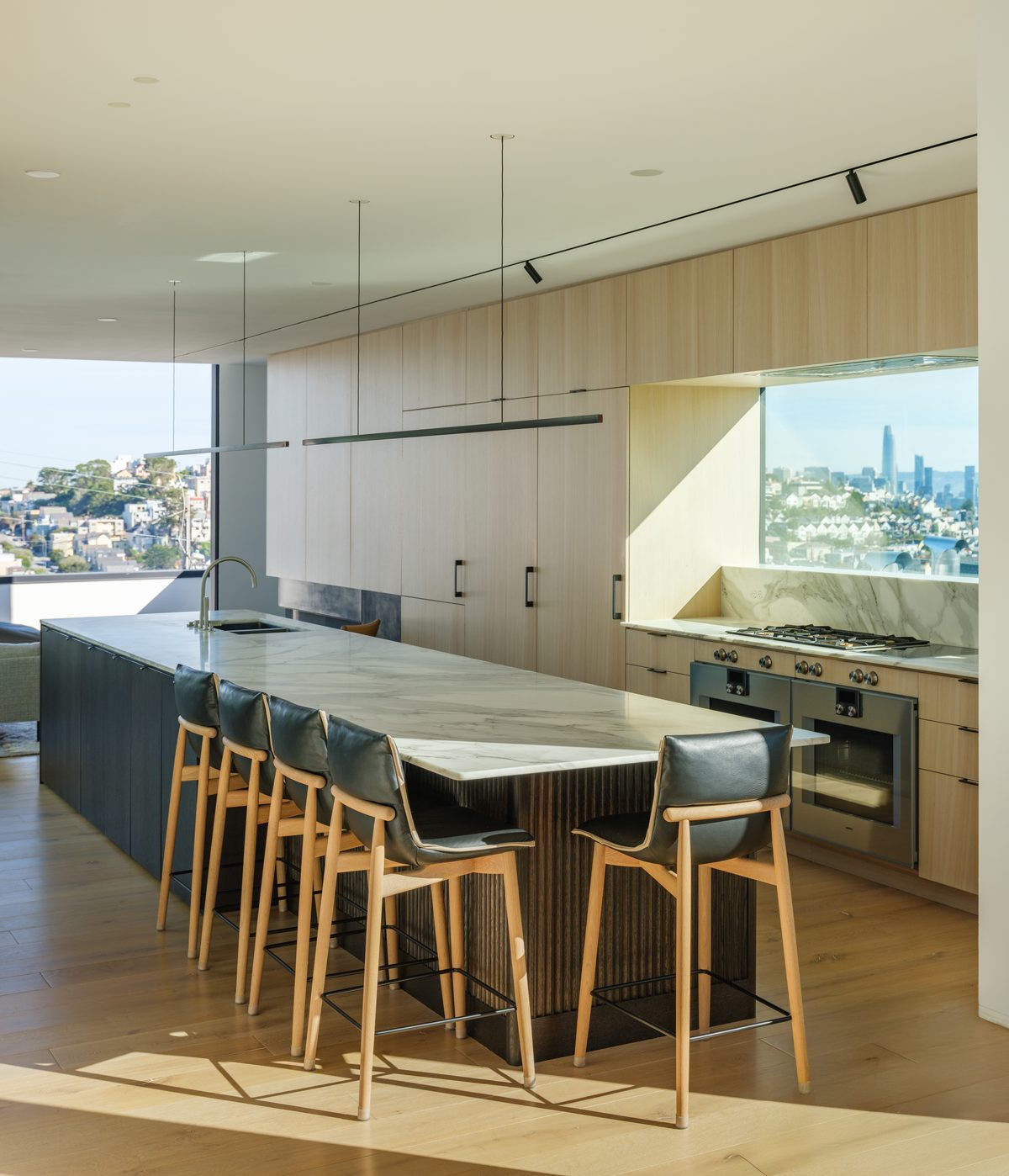 Kitchen bar seating with the city beyond