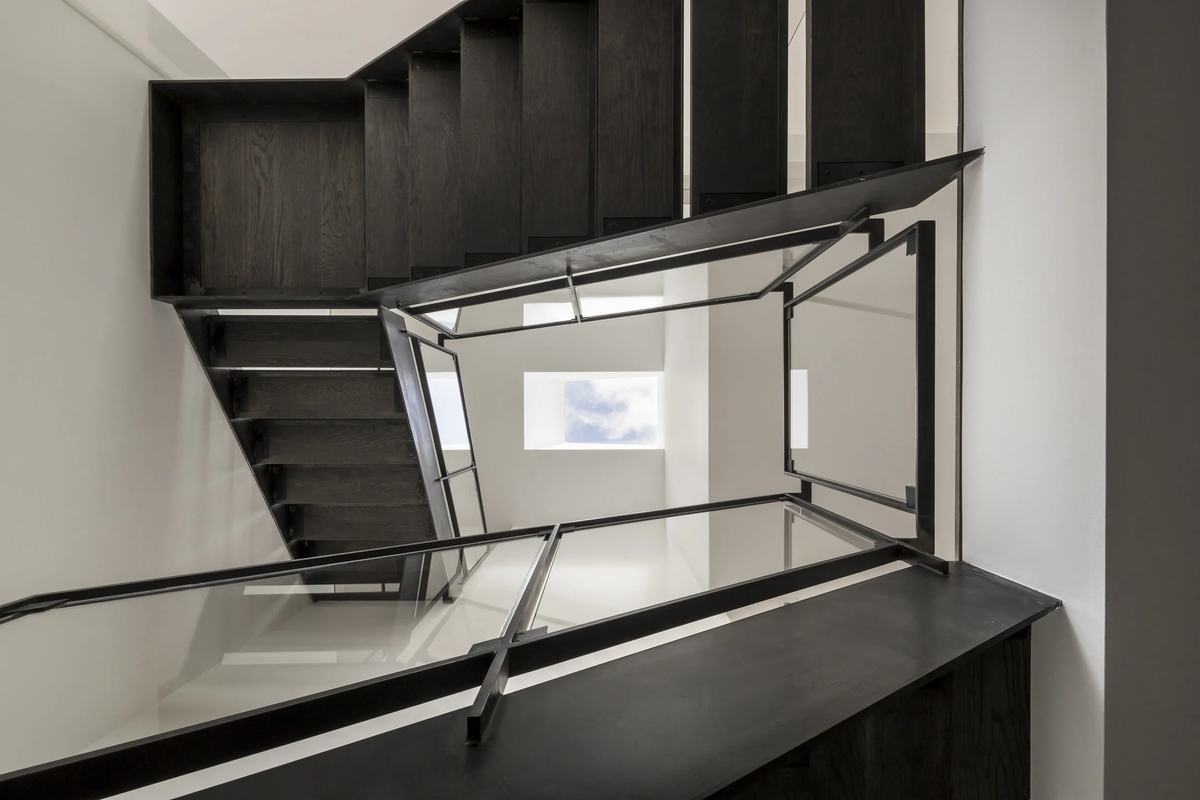 Stair and glazed guard seen from the landing above