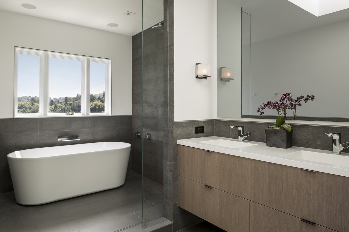 Primary bathroom with a freestanding tub and glass shower